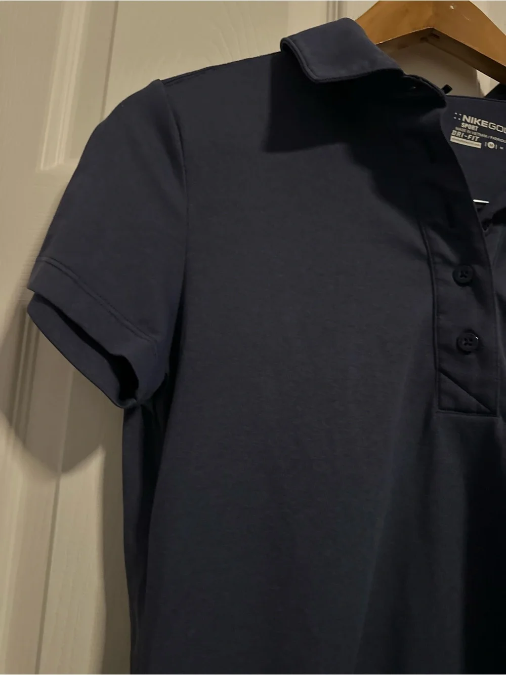 Nike Women's Navy Polo Top with Rhinestone Swoosh